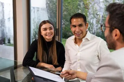 Front view couple talking to real estate agent