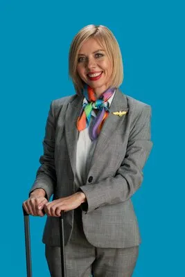 Medium shot smiley stewardess posing