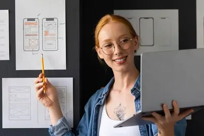 Female web designer in the office with laptop
