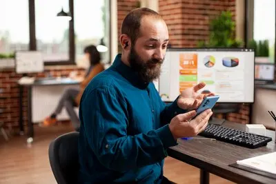 Bearded man using phone for videocall