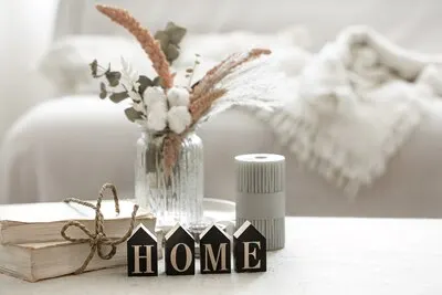 A cozy composition with details of the interior decor and the decorative word home.
