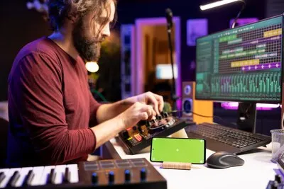 Audio engineer uses knobs on stereo gear for mixing and mastering session