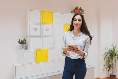 Beautiful businesswoman with tablet posing in the office