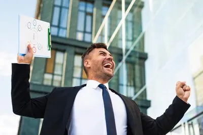 Young business man being happy low view