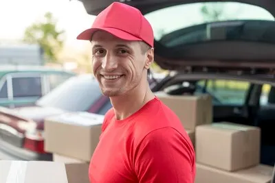 Medium shot delivery man smiling