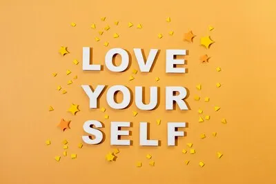 Self love lettering in paper style arrangement