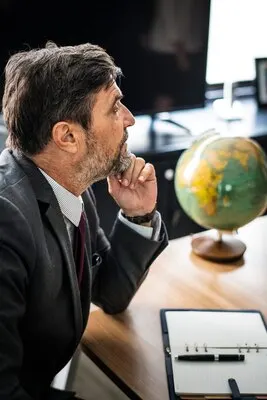 Businessman sitting alone by a table