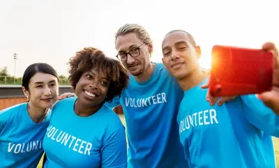 Diverse volunteers taking a selfie together